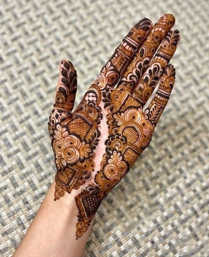 This may contain: a person's hand with hennap on it