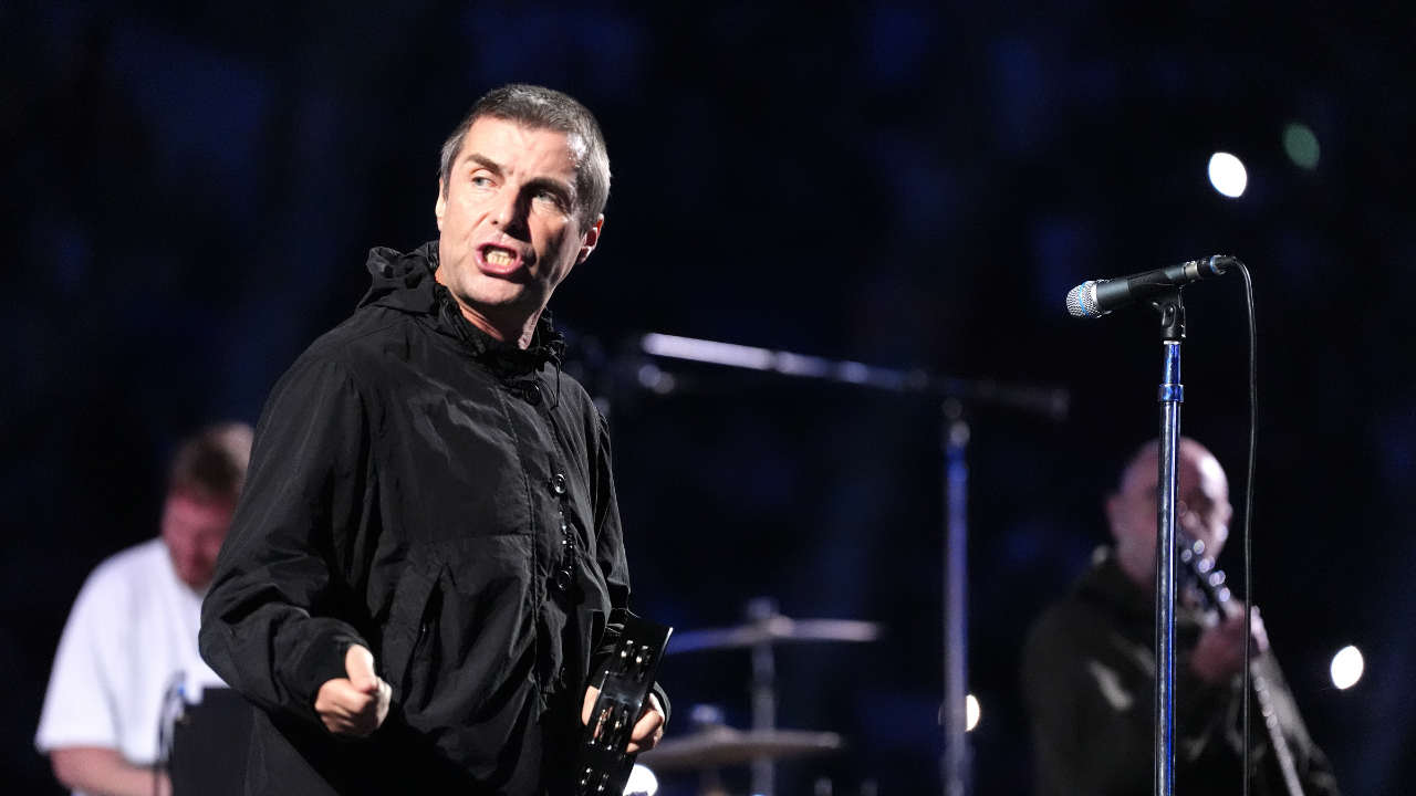 Liam Gallagher of Oasis performing ahead of the IBF World Heavyweight bout