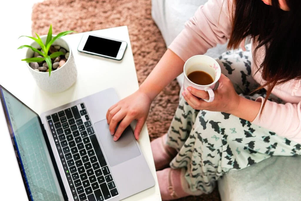 Woman-sitting-on-sofa-surfing-online-in-pajamas-1024x683.webp